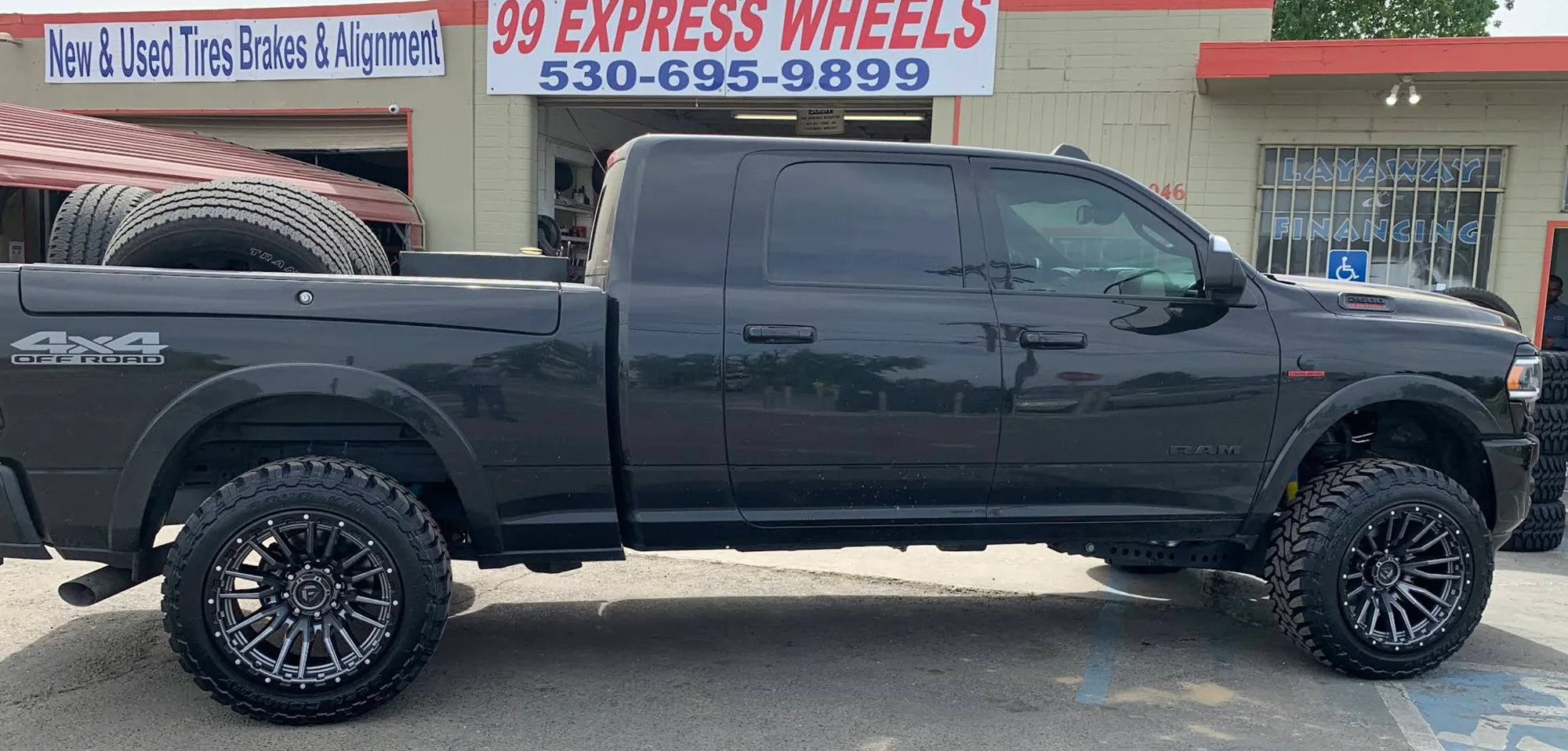 Ram 2500 with custom wheels and off-road tires at 99 Express Wheels